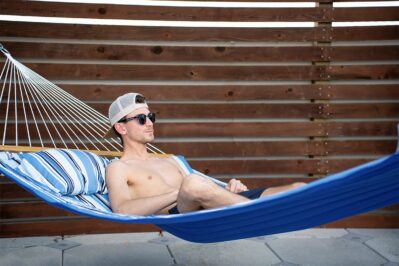Young man relaxing on a hammock