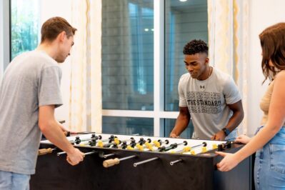Residents playing foosball